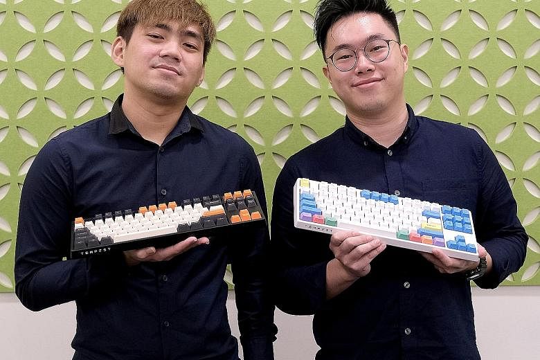 Local tech start-up Tempest co-founders Eric Heng (left) and Ben Hui with the brand's Kirin keyboards, which were launched last month. The third co-founder, Issac Yuen, was not at the photo shoot.
