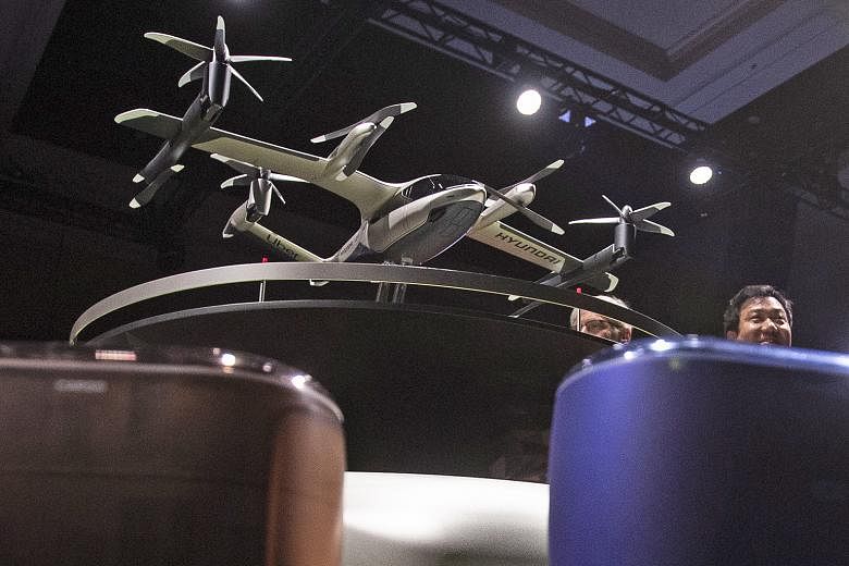 An S-A1 model aircraft of the Hyundai and Uber Elevate urban air taxi concept being displayed at a press conference at the Consumer Electronics Show in Las Vegas on Monday. The aircraft utilises "distributed electric propulsion", designed with multip