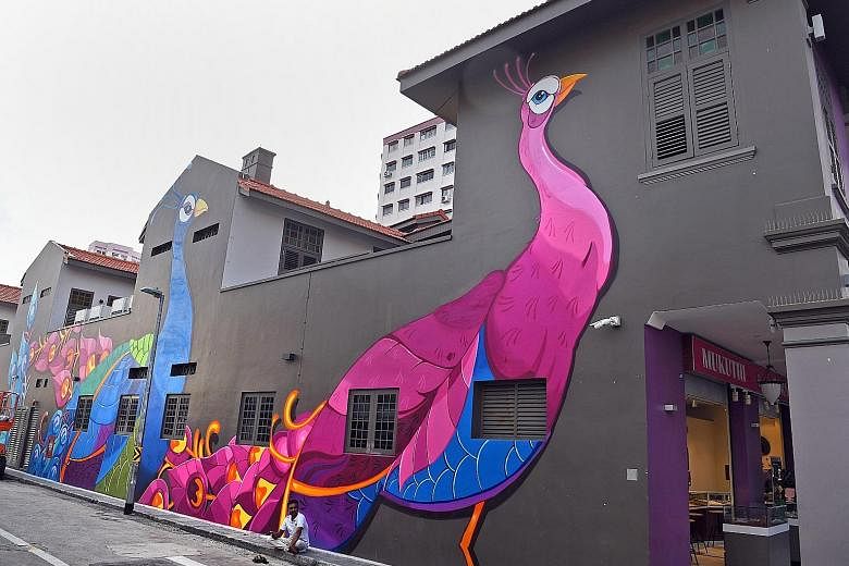 Top left: Theatre group Wisdom of Monkeys performing Temple during a media preview. The actual performance will be at Rowell Road during the event dates. Above: On the wall of Aqueen Heritage Hotel Little India in Belilios Lane is a 70m-long mural, t