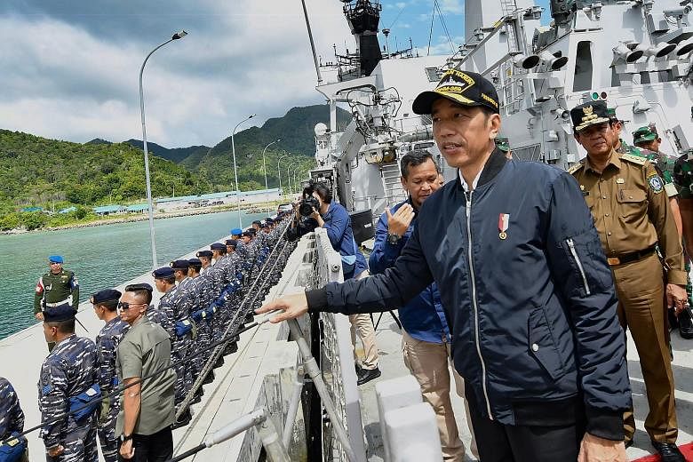 President Joko Widodo on a visit to a military base in the Natuna Islands. His visit yesterday came two days after he asserted that Indonesia's territorial integrity was "non-negotiable".