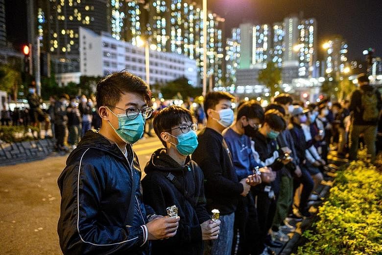 Mourners at a memorial service for Mr Alex Chow, 22 - who died two months ago from head injuries sustained after a fall inside a multi-storey carpark during clashes between the police and protesters - at Tseung Kwan O district of Hong Kong on Wednesd