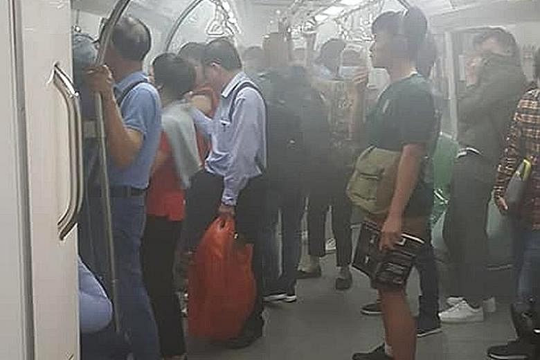 White smoke inside the cabin of the MRT train at Tanjong Pagar yesterday.