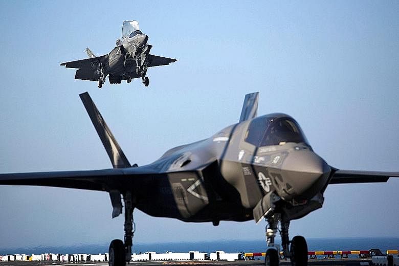 The F-35B jets (left), which can take off from shorter runways and land vertically, are meant to replace Singapore's ageing F-16 fleet, which has been in service since 1998. PHOTO: REUTERS