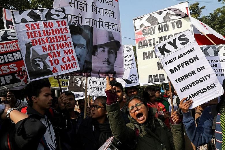 Demonstrators carrying placards and shouting slogans during a protest march on Thursday against the Jawaharlal Nehru University attacks.