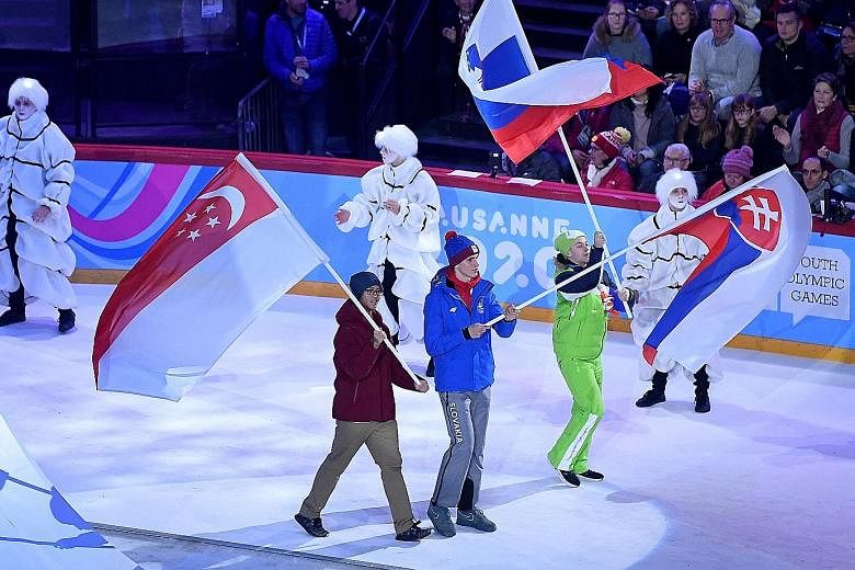 The Winter Youth Olympic Games began in Lausanne, Switzerland, on Thursday, with ice hockey player Matthew Hamnett (far left) representing Singapore at the opening ceremony at the Vaudoise Arena. Two other Singaporeans, short track speed skaters Alys