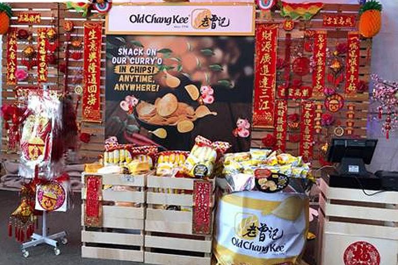 The Old Chang Kee CNY Makan Food Street sells food items such as the Curry Puff Flavour Potato Chips festive pack, crispy prawn rolls and other Chinese New year merchandise. PHOTO: OLD CHANG KEE
