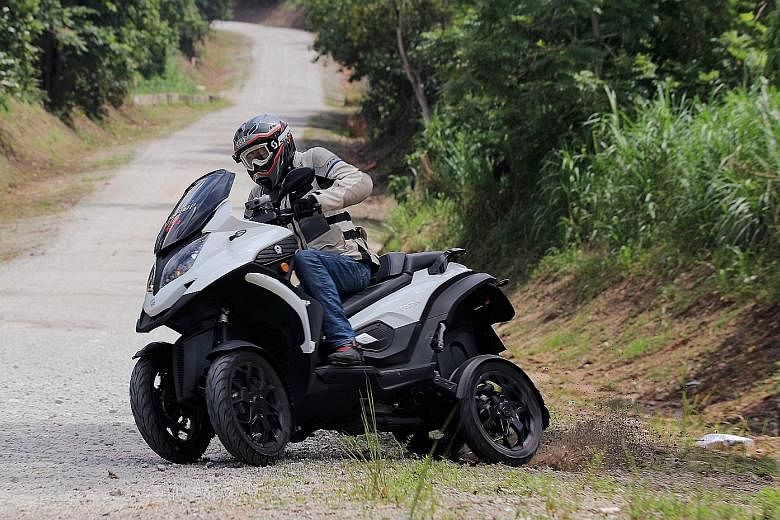 The four-wheeled Quadro Qooder can grip corners better than conventional motorcycles. It is also able to drift into turns and absorb potholes better.