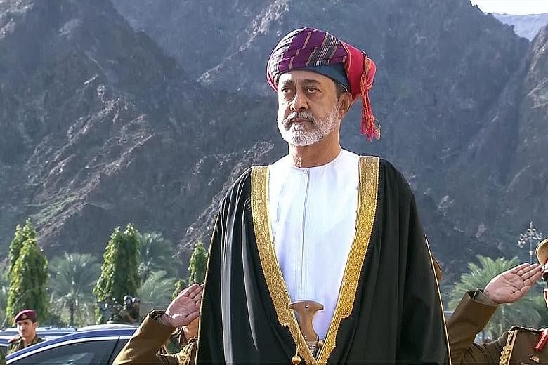 Oman's Sultan Haitham (left) was sworn in as the country's new leader yesterday following the death of his cousin Sultan Qaboos bin Said (above), seen as the father of modern Oman. PHOTOS: AGENCE FRANCE-PRESSE, ASSOCIATED PRESS