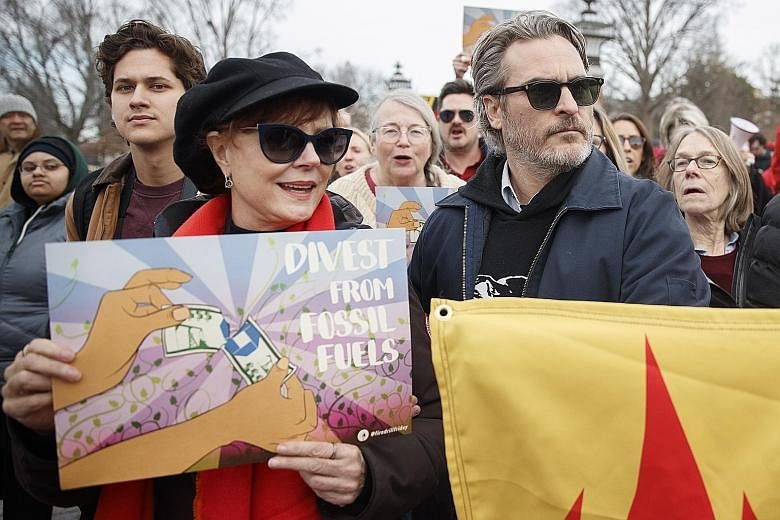 Susan Sarandon and Joaquin Phoenix taking part in a march with protesters against climate change at the US Capitol on Friday. Other Hollywood celebrities who joined the protesters included Jane Fonda and Martin Sheen.