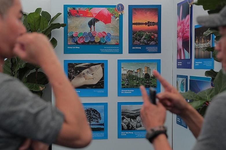 Photos submitted for national water agency PUB's #MyTakeOnWater photo challenge on display at Ngee Ann City yesterday.