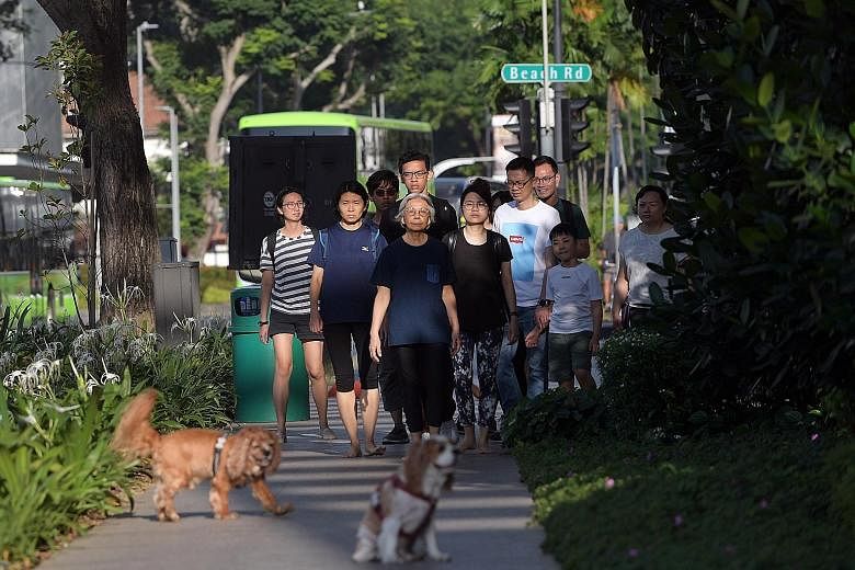 Artist Amanda Heng, with fellow performers behind her, doing a reprise of her classic performance art piece Let's Walk as part of the Singapore Biennale. Ms Heng, whose works explore social and cultural issues, said last night that receiving the Bene
