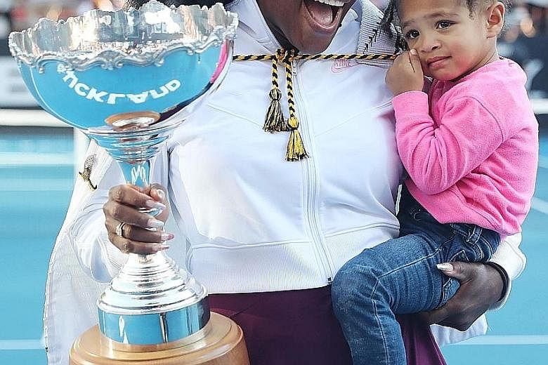 Serena Williams, 38, with her two-year-old daughter Olympia after her win against fellow American Jessica Pegula in yesterday's Auckland Classic final. It was Williams' 73rd career title but the first time she has lifted a trophy since giving birth.