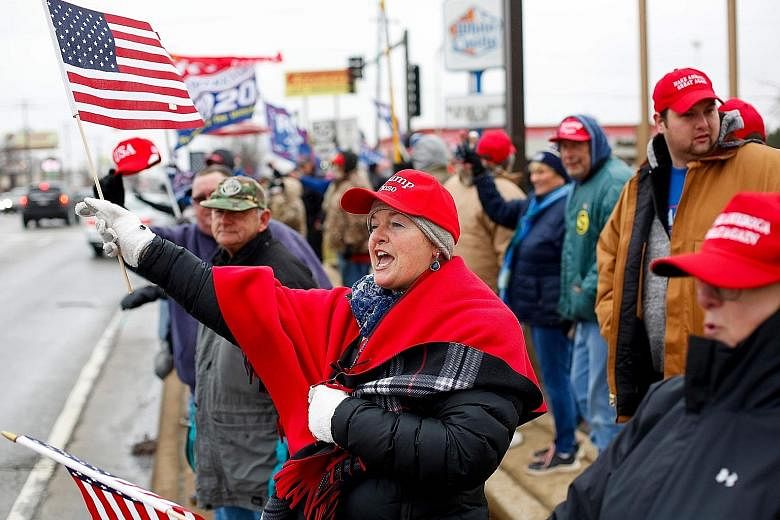 Demonstrators at a pro-Trump rally in the US state of Illinois on Saturday. The current trade truce could help President Donald Trump on the campaign trail by giving the American economy a boost. A worker packing bottles of oil made from imported US 