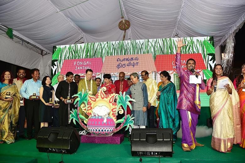 A light-up event for the Pongal festival last Friday, where the guest of honour was Minister in the Prime Minister's Office Indranee Rajah (wearing red). ST PHOTO: DESMOND WEE Tamils who celebrate Pongal shop for items such as sugar cane, vegetables 