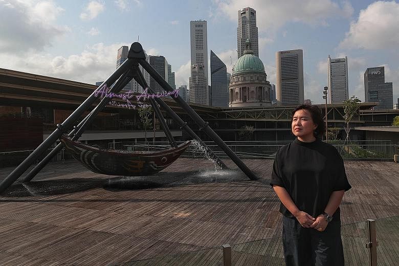 Beijing-based artist Cao Fei with the 5m-tall installation, Fu Cha, on the roof of the National Gallery Singapore.