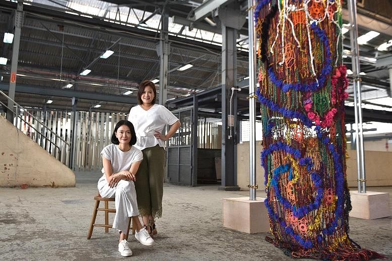 (From top) Dawn Ng's mirrored work, Merry Go Round; Nicholas Ong's Absurd Theatrics series; and the facade of the Kwong Soon & Co Engineering Works building in Cavan Road. Artist Dawn Ng (seated) and Audrey Yeo, founder of the Singapore Arts Club, wi