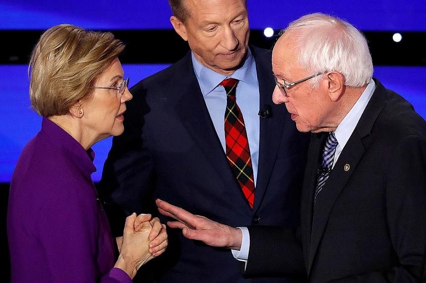 Ms Warren in a tense exchange with Mr Sanders moments after the debate, as Mr Steyer looked on. Ms Warren had walked towards Mr Sanders, who offered his hand, but she declined to take it, clasping her hands instead.