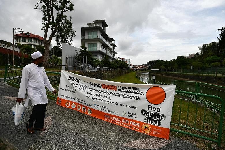 A dengue alert banner put up in Gerald Drive. Last week, 345 people were diagnosed with dengue - a 50 per cent rise over the number of infections seen in mid-December.
