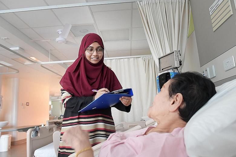 Dr Mumtaz Mohamed Yusoff with a mock patient at Changi General Hospital. As a child, she threw herself into studying to escape the turmoil at home. Now a doctor at Tampines Polyclinic, she says her struggles have helped her develop more empathy for h