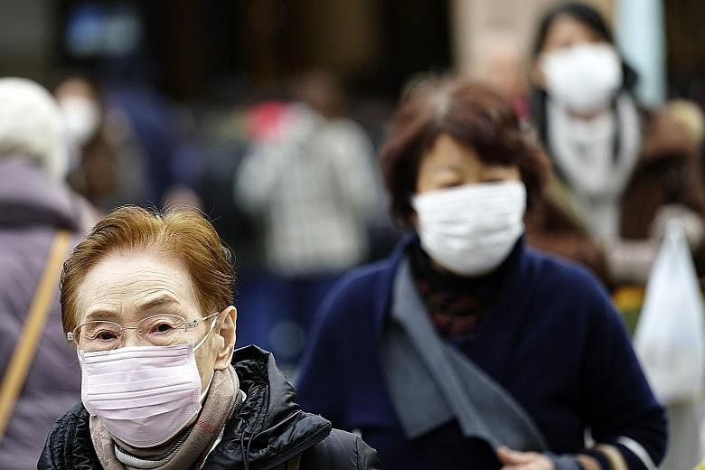 The Wuhan virus outbreak coincides with the annual flu season in Japan, and the country's Health Ministry has reiterated its advisory for people to wash their hands, gargle, and wear masks to avoid falling sick. PHOTO: ASSOCIATED PRESS