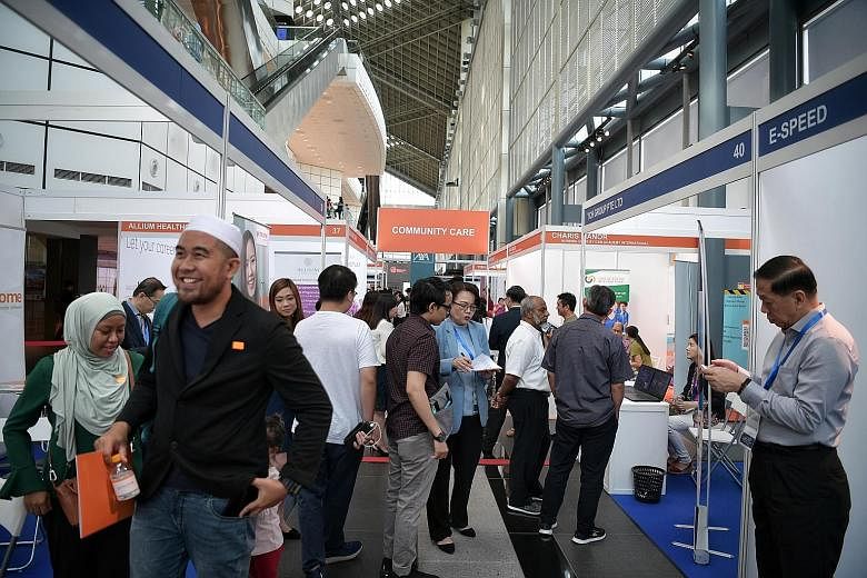 The ST Jobs Career and Learning Fair last year. Changes to the Fair Consideration Framework will nudge employers to reconsider their hiring strategies, driving up competition for local workers, according to academics and human resources experts.