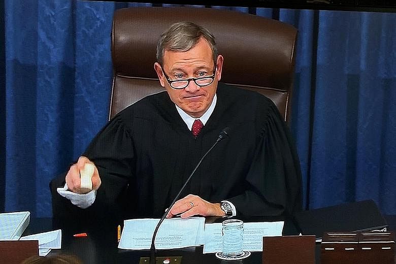 Chief Justice John Roberts banging the gavel to adjourn the first session of the impeachment trial, which will resume on Tuesday. Chief Justice John Roberts swearing in senators during the procedural start of the impeachment trial of President Donald
