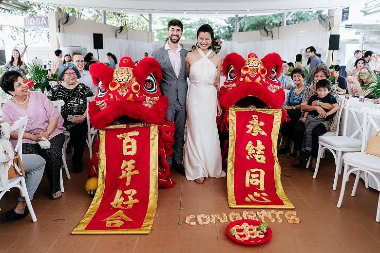 Some 150 guests, including friends and family from England, Ireland, Slovakia, Switzerland, Chicago and Los Angeles, attended the couple's Jewish-style wedding with a lion dance at a covered linkway in Clementi Avenue 4. Food from their favourite Ind