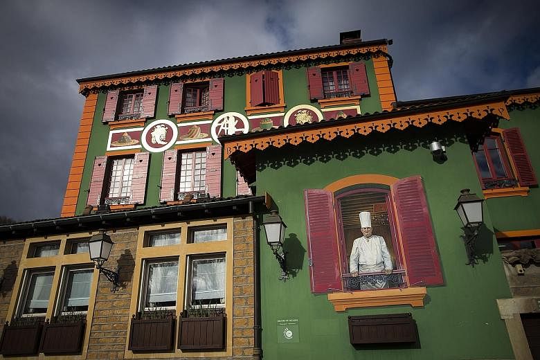 A mural depicting the late French chef Paul Bocuse on a wall of his restaurant L'Auberge du Pont de Collonges, in Lyon, France. The restaurant has just lost its three-star Michelin rating, two years after his death in 2018. PHOTO: EPA-EFE