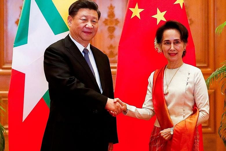 Chinese President Xi Jinping and Myanmar State Counsellor Aung San Suu Kyi before a bilateral meeting at the Presidential Palace in Naypyitaw, Myanmar, yesterday. PHOTO: AGENCE FRANCE-PRESSE