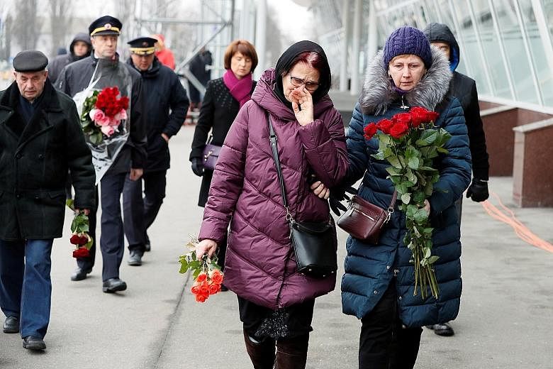 Relatives of the Ukrainian victims of the plane disaster arriving for a memorial ceremony at the Boryspil International Airport in Ukraine yesterday. PHOTO: REUTERS