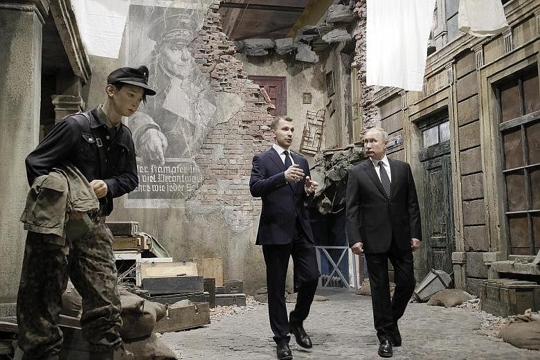 President Vladimir Putin visiting the 3D panorama "Memory Speaks. The Road Through The War" exhibition in Saint Petersburg last Saturday. He says a transition plan for Russia is crucial.