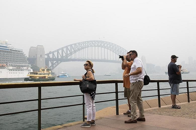 Sydney shrouded in haze earlier this month. The Australian government said the A$76 million (S$70 million) aid is an initial push to help the country's A$152 billion tourism industry, which accounts for more than 3 per cent of annual economic output.