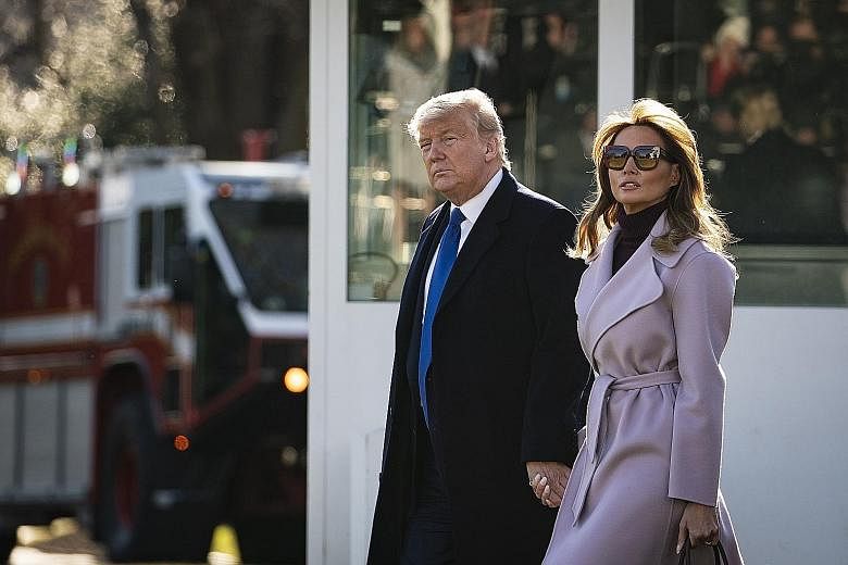 US President Donald Trump and First Lady Melania Trump at the South Lawn of the White House last Friday. The White House is slated to file its more complete trial brief today at noon, which will expand on the arguments in Saturday's filing.