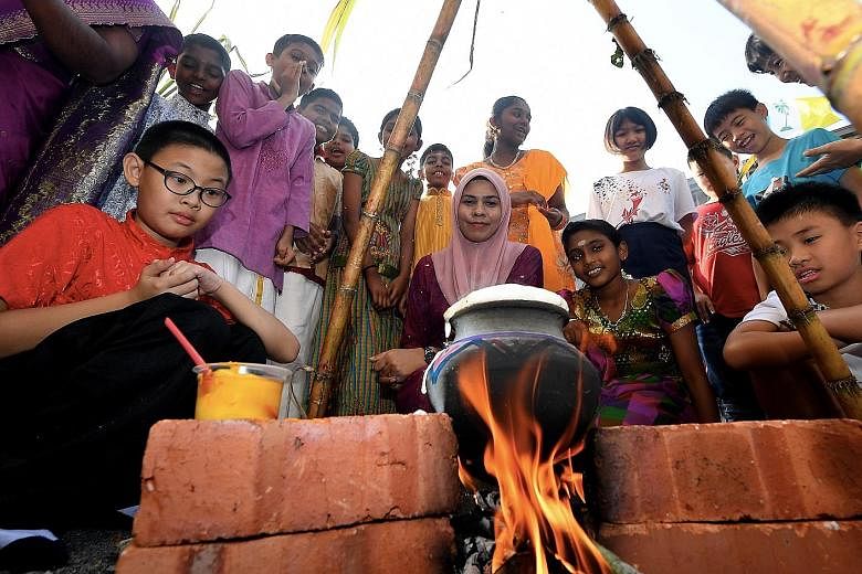 Students and staff of a school in Penang during Pongal celebrations last Friday. The Tamil festival was at the centre of recent race-baiting issues in which the Malaysian Cabinet had to intervene.