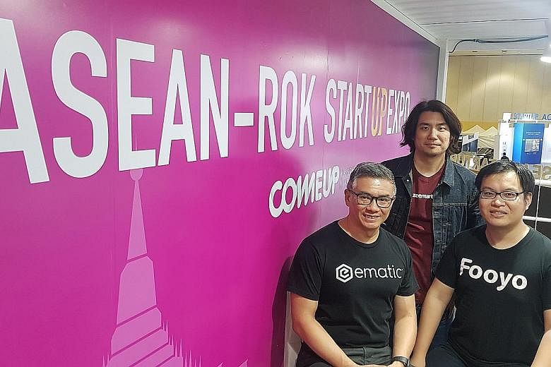 Representatives of three Singapore start-ups - (from left) Ematic Solutions chief financial officer Simon Wong, Zeemart chief product officer Keith Tan and Fooyo co-founder Li Shaohuan - at the Asean-ROK Start-up Expo in Busan last November. The upco