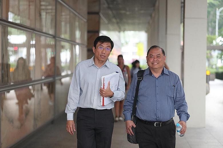 SDP secretary-general Chee Soon Juan (left) and vice-chairman John Tan (right) leaving the Supreme Court on Thursday.