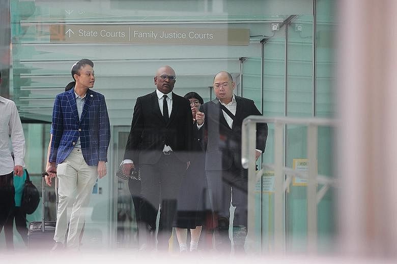 (From left) Daniel De Costa, lawyer M. Ravi and editor of TOC Terry Xu outside the State Courts yesterday. District Judge Christopher Tan, after hearing the case yesterday, said there was no novel question of law in the case that warranted a referral