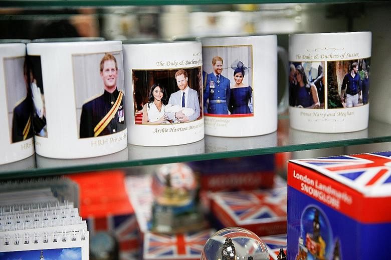 Souvenir mugs depicting Britain's Prince Harry and his wife, Meghan, Duchess of Sussex, on display in a shop near Buckingham Palace in London. Most speculation about where they will live in Canada has centred on three places: Vancouver and Victoria, 