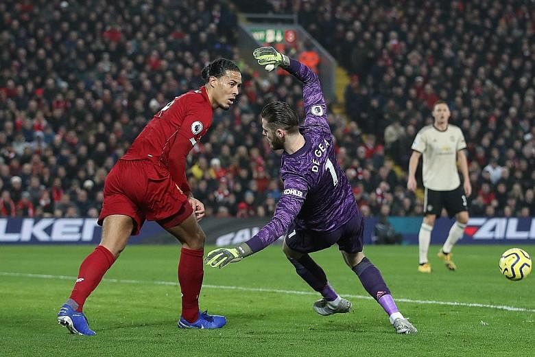 Goalkeeper David de Gea falling after a clash with Liverpool's Virgil van Dijk in Sunday's Premier League game. Referee Craig Pawson did not give a foul and Manchester United's players confronted him to protest after Roberto Firmino scored in the aft