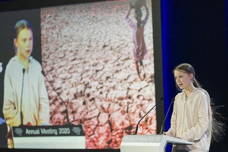 Swedish climate activist Greta Thunberg addressing a panel session at the opening of the World Economic Forum in Davos yesterday.