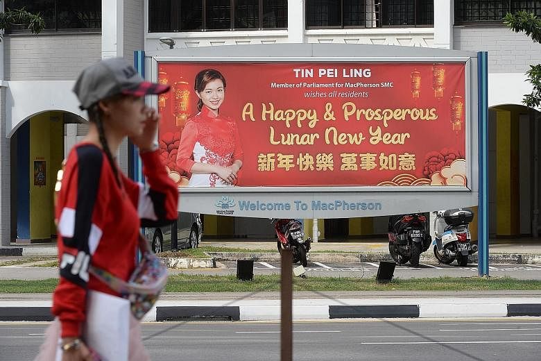 This banner in Pipit Road shows the original Chinese New Year greetings and photo of MacPherson MP Tin Pei Ling.