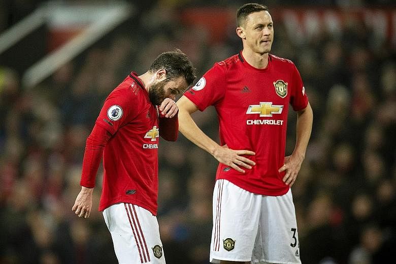 Manchester United midfielders Juan Mata (left) and Nemanja Matic are part of an underwhelming Red Devils squad experiencing their worst top-flight season in 30 years. PHOTO: EPA-EFE