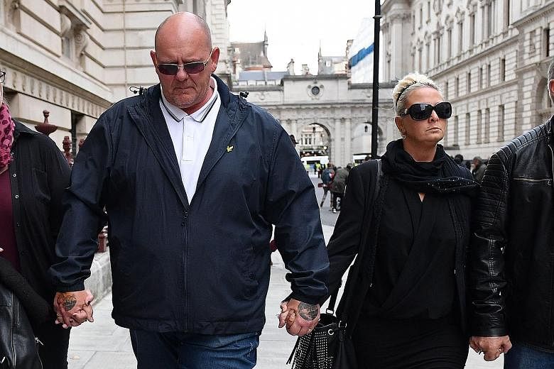 Mr Tim Dunn and Ms Charlotte Charles, the parents of teenage motorcyclist Harry Dunn. PHOTO: AGENCE FRANCE-PRESSE