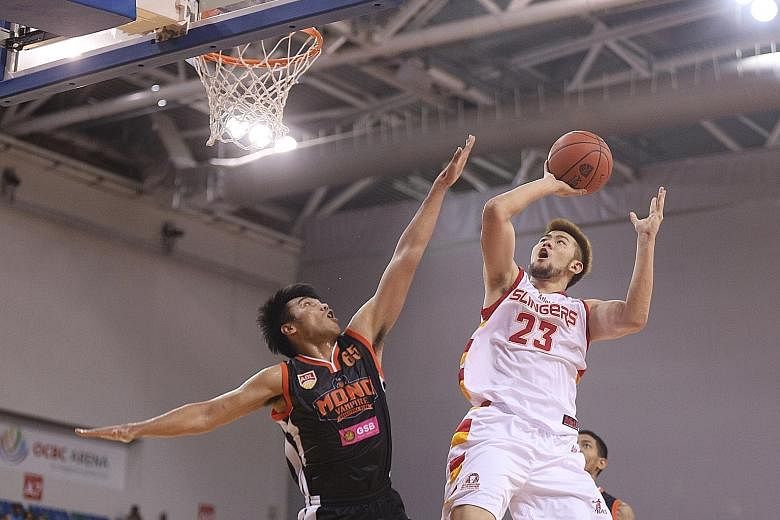 Mono Vampire's Teerawat Chanthachon trying to block Slingers forward Delvin Goh's shot during last Sunday's ABL match at the OCBC Arena. The Slingers were edged out 67-65 and are third from bottom in the league with three wins in eight games. 