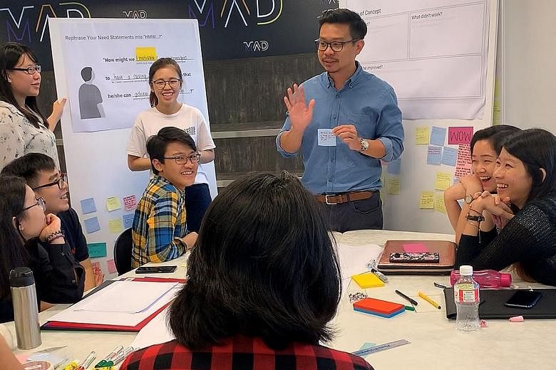 Singapore Polytechnic students in a discussion at a workshop to identify what they wanted from the United Overseas Bank branch on their campus. Operations at the branch started last November.