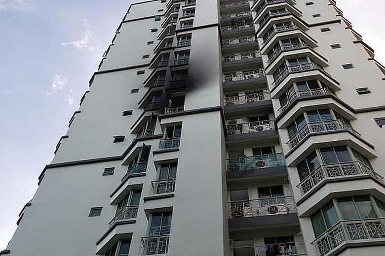 Left: The third fire broke out at a condominium unit in 5 Buangkok Green, Hougang, yesterday. Preliminary investigations found that the fire started in a bedroom where an e-bicycle battery was being charged. The first fire took place at a two-storey 