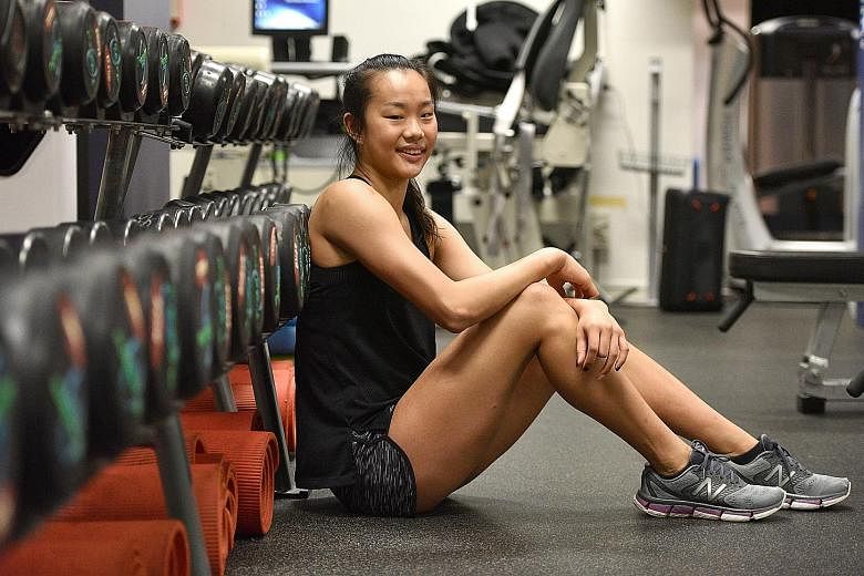 Tan Sze En, 19, at the Singapore Sport Institute gym, where she usually trains for strength and conditioning. She is less worried over physical pain than regretting if she gave up. 