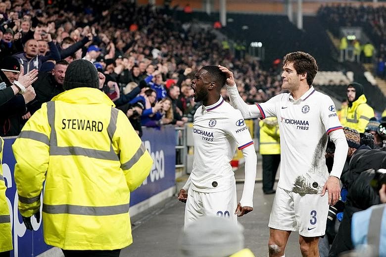 Fikayo Tomori celebrating with fans after putting Chelsea 2-0 up against Hull in the FA Cup, as Marcus Alonso joins in. The Blues won 2-1. 