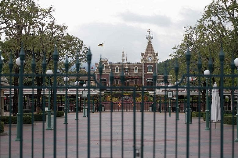 A closed Hong Kong Disneyland yesterday. The park said it was shutting its doors to protect "the health and safety of our guests and cast members".