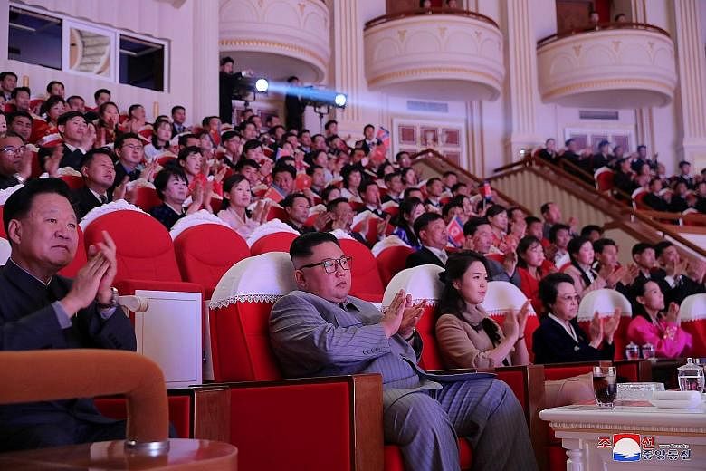 North Korean leader Kim Jong Un at a performance to celebrate Chinese New Year in Pyongyang on Saturday. With him are wife Ri Sol Ju and aunt Kim Kyong Hui, seen in public for the first time in six years. PHOTO: AGENCE FRANCE-PRESSE